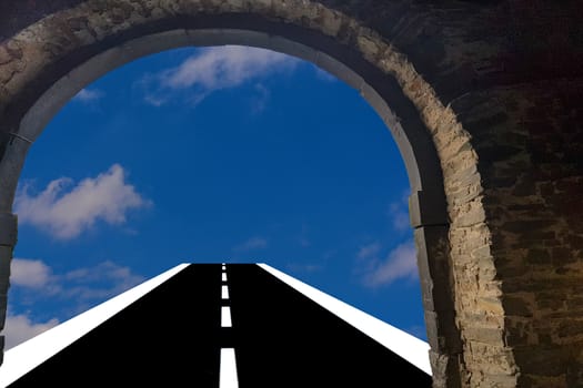 View through a door arch. Asphalt road leads into the blue cloudy sky  Background