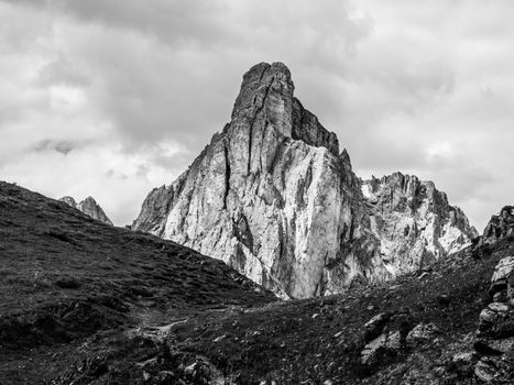 Passo Giau with Mount Gusela on the background, Dolomites, or Dolomiti Mountains, Italy. Black and white image.