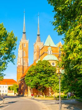 Gothic style Cathedral of St. John the Baptist on Tumski Island, Wroclaw, Poland. Back side view from the street.