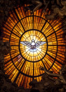 ROME, ITALY - AUGUST 24, 2018: Throne Bernini Holy Spirit Dove Saint Peter's Basilica Vatican Rome Italy. Bernini created Saint Peter's Throne with Holy Spirit Dove Stained Glass Amber in 1600s