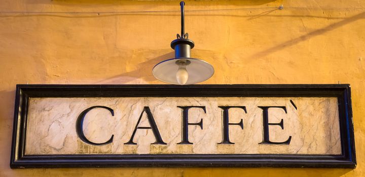 Rome, Italy. Tradiotional vintage style coffee sign on the wall.