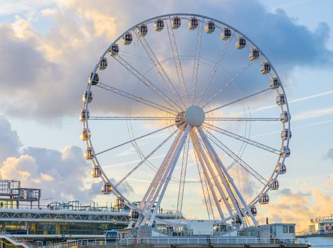 big ferris wheel attraction at the pier of Scheveningen beach Holland a well-known and touristic town