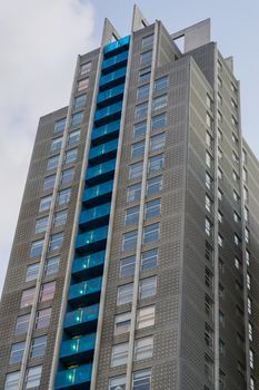 large skyscraper full of apartments with balcony's exterior architecture background