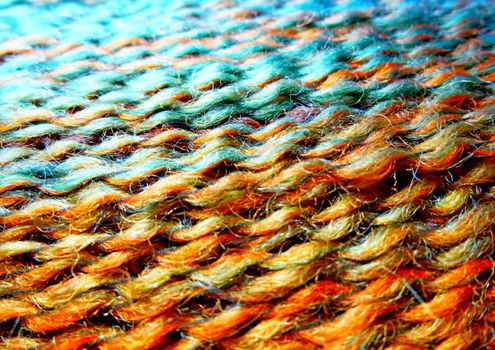 Skein of wool yarn. Macro shooting. Texture of wavy thread. Bright multicolor threads. Background image. Hobbies leisure crafts