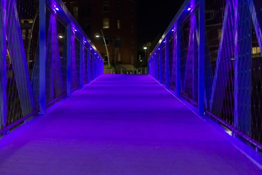 Modern city architecture a blue lighted bridge walking the streets of scheveningen the netherlands urban cityscape scenery