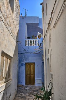 Door of purple house on narrow street of ancient Medina, Hammamet, Tunisia, Mediterranean Sea, Africa, HDR