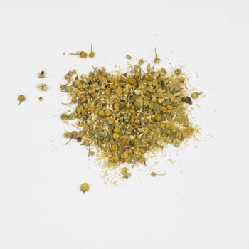 dried chamomile flowers in a white table