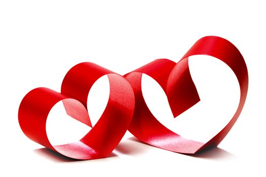 Red hearts of ribbon bow isolated on white background