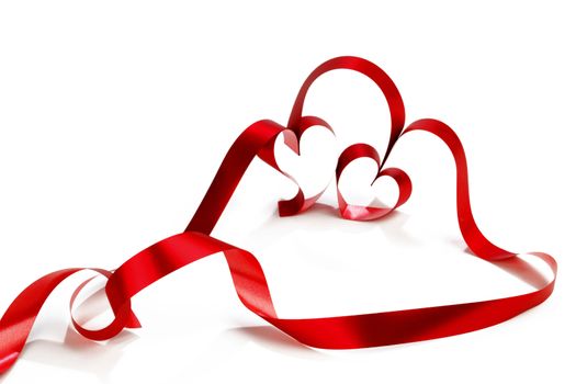 Hearts from red ribbon isolated on white background