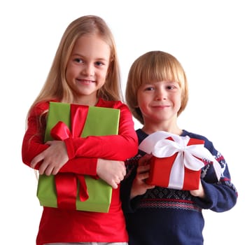 Portrait of two happy children with Christmas gift boxes isolated on white background