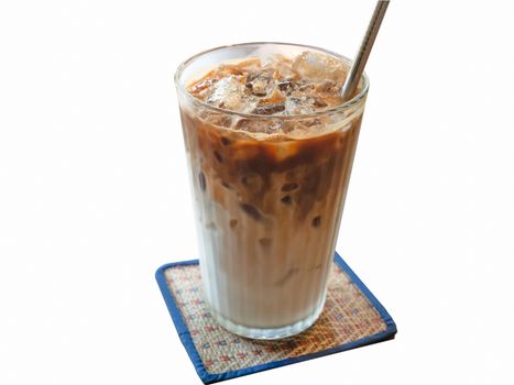 A shot of a glass of ice cold coffee isolated on a mat background. Front of the glass in focus.