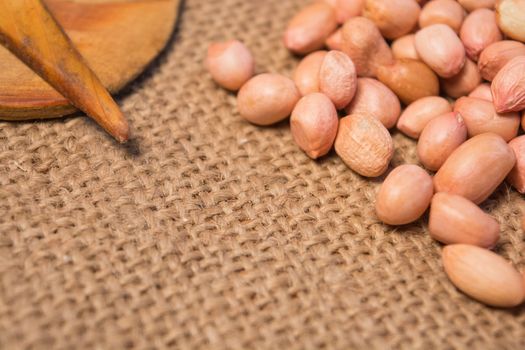 Group of Garlic and grounnuts with some props on sackcloth for food