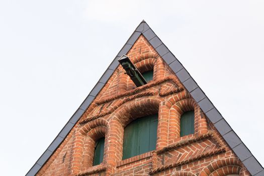 Typical gable of buildings in Lüneburg, Germany, with pulley blue sky and copy space