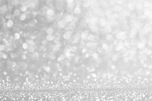 Abstract shining glitters silver holiday bokeh background with copy space for text