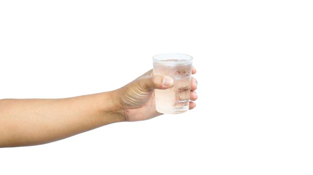 Hand holding a glass of water