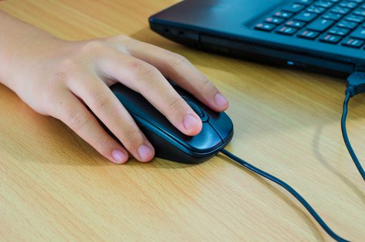 hands clicking computer mouse