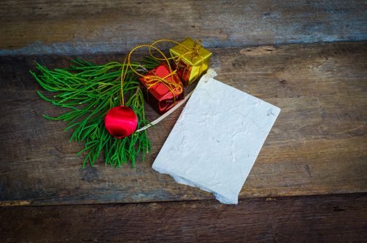 card for Christmas on wood background