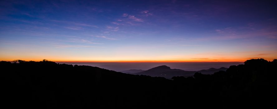 The sun was rising on the horizon, Silhouetted in the morning.