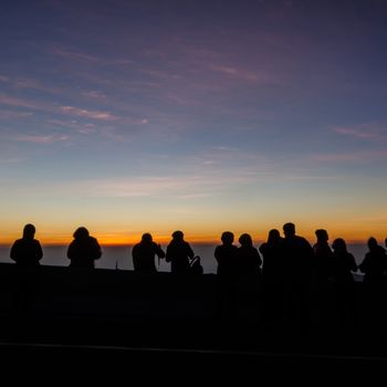 The people silhouette are waiting watch for the sun rise,in the morning