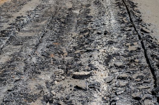 Road damage, with holes