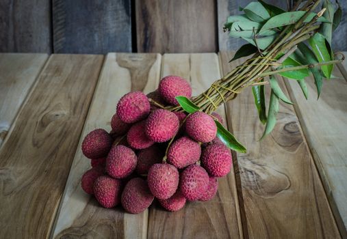 Lychee or Litchi on a wooden table.