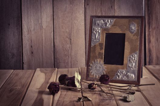 Still life picture frames, vases, dried rose notebook concept frequent memories.