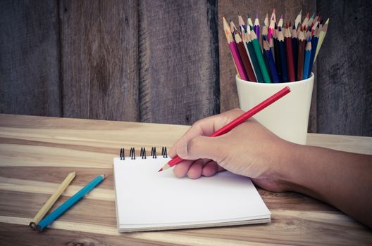 Hand drawing in open notebook on table