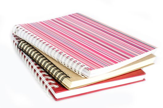 Notebook full of colorful rings put on a white background.