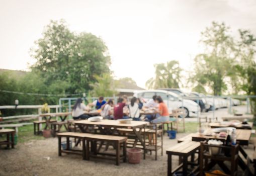 Blur restaurant with customers to access services.