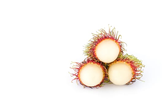 Thailand red rambutan fruit is sweet on a white background.