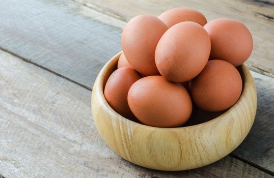 Place the egg in a cup on wood