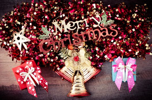 Merry Christmas greeting message on wooden background