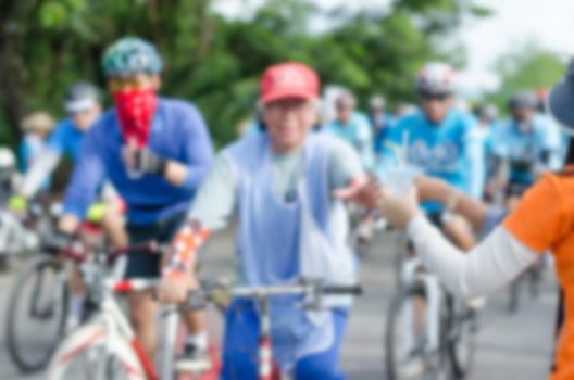 Blur cyclist drinking water.