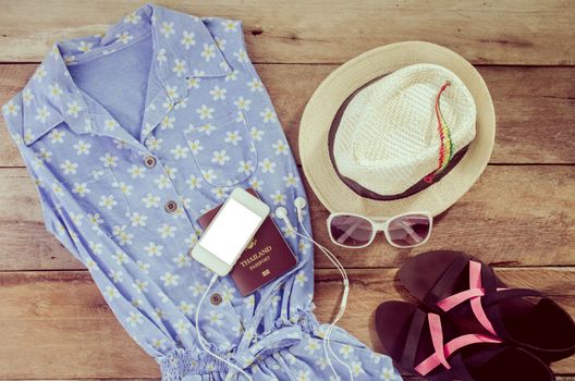 Travel accessories, shoes, underwear, hats, glasses, passport,smart phone. Get ready to travel