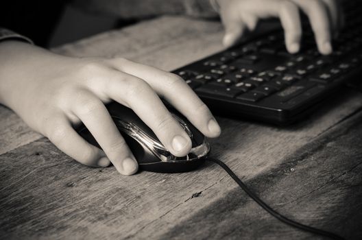 hand and mouse computer working - tone vintage