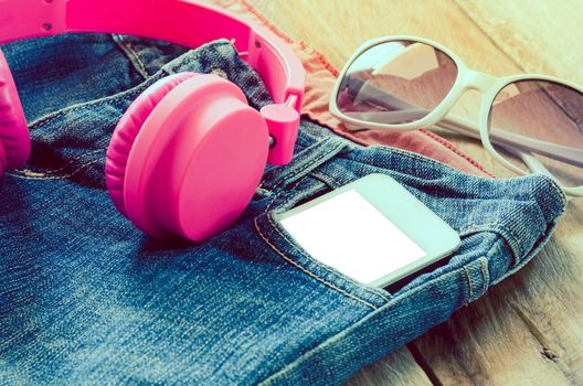 accessory jeans smart devices Earphone,glasses on a wooden floor
