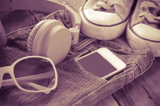 accessory jeans smart devices, glasses on a wooden floor tone vintage