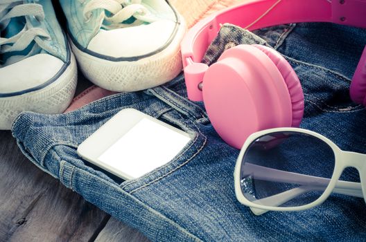 accessory jeans smart devices Earphone,glasses on a wooden floor