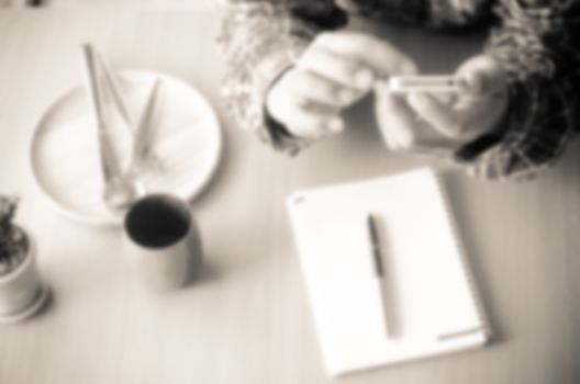Blur image a man working from home using smart phone