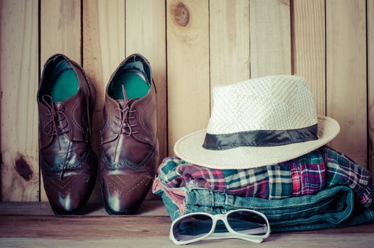 Travel accessories. Shirts, jeans, hats,shoes, ready for the trip
