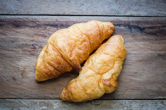 Croissants on a wooden floor