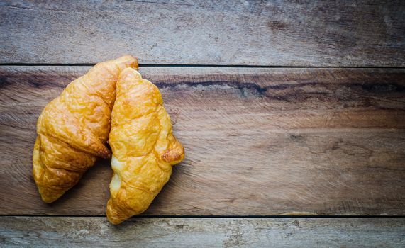 Croissants on a wooden floor