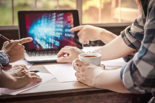 Close-up of  business people working on project together. Teamwork , hipster tone