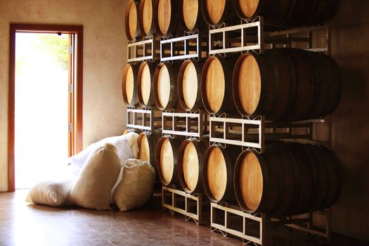 Barrels of wine and sugar in bags in of Napa, California.