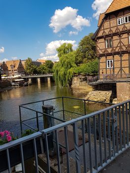 Half-timbered red brick houses near the river on the old harbor Lueneburg, Germany