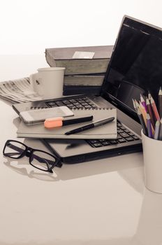 office desk with laptop with business accessories and cup of coffee