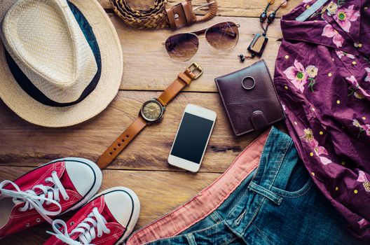 Travel accessories, clothes, wallet, glasses, phone, pasport, shoes, hat ready for travel