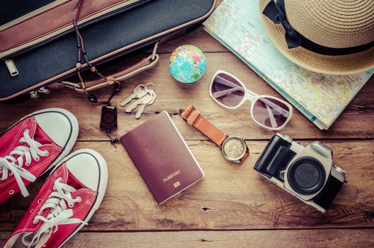 Travel accessories on wooden floor ready for travel
