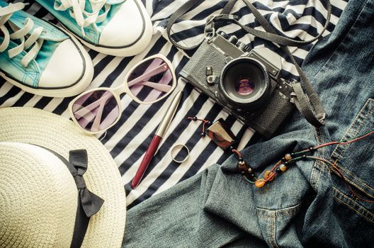 Travel accessories and costume on wooden floor