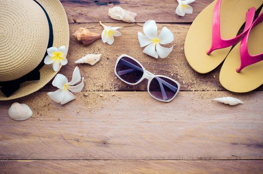 Travel accessories for summer on wooden background
